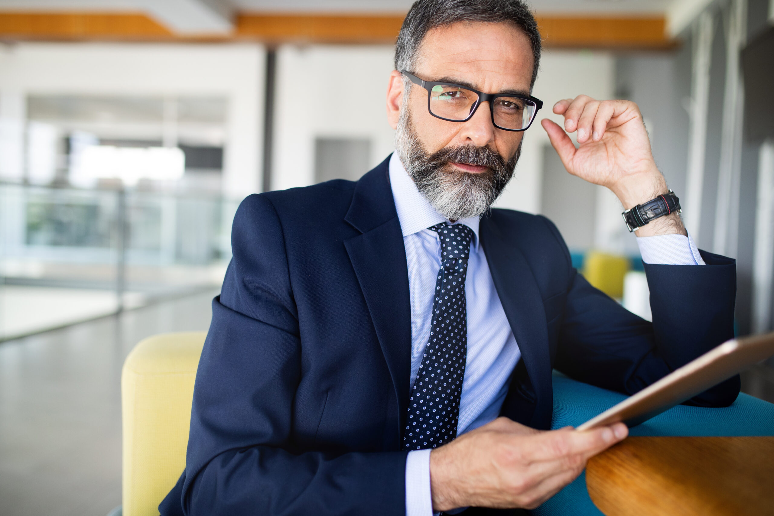 confident senior businessman leader working in office