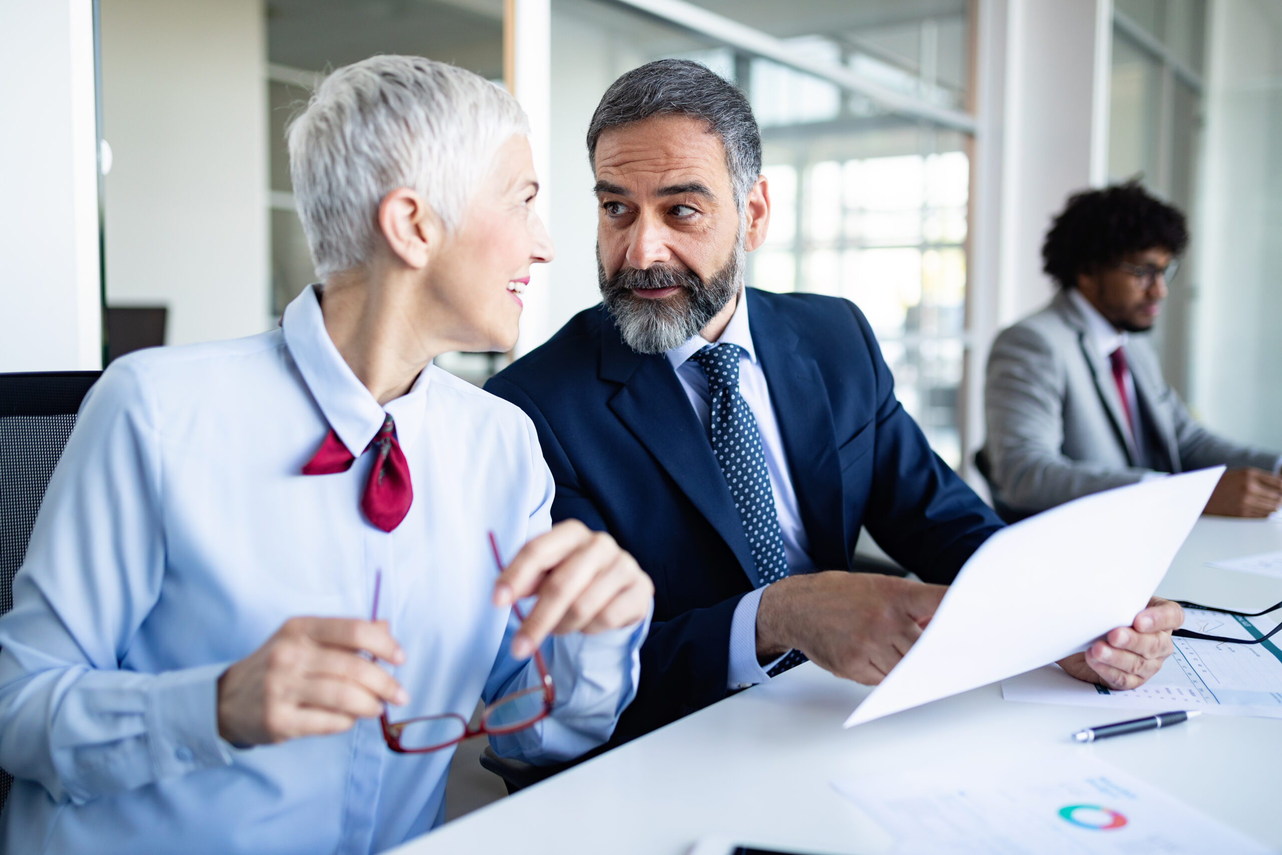portrait of happy business people discussing together in office