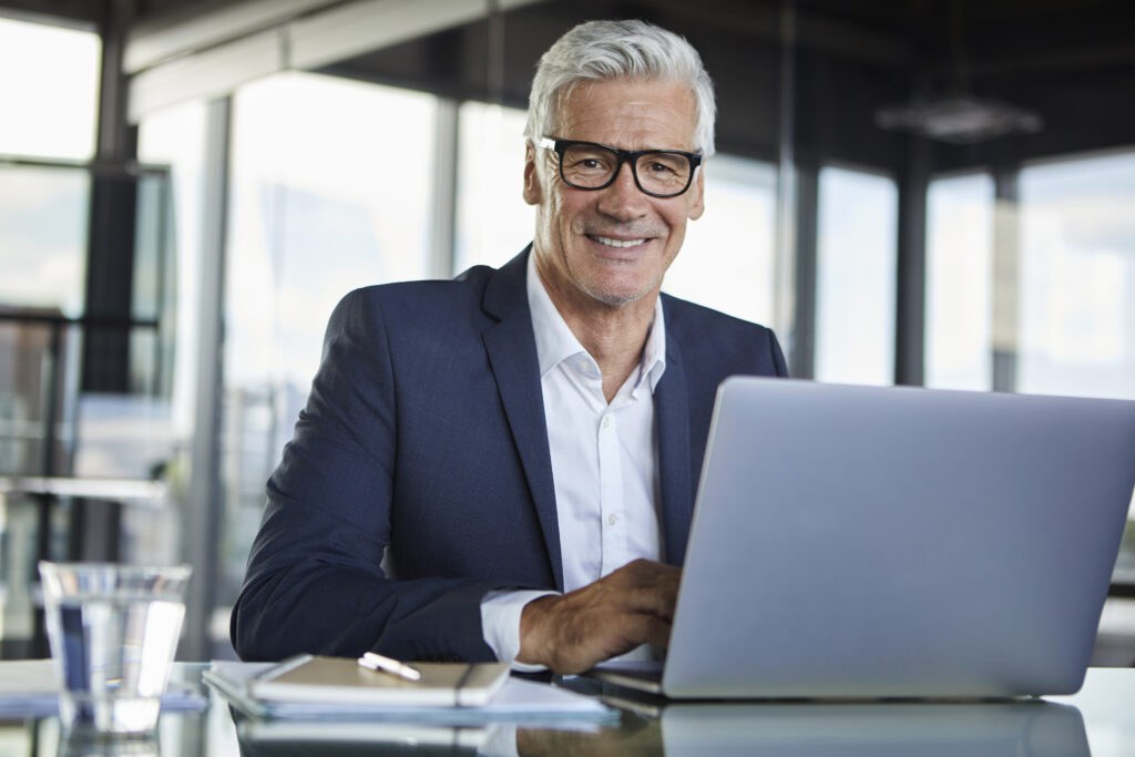 businessman working in office, using laptop