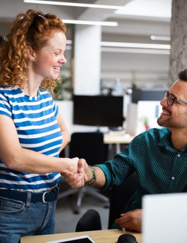 programmers cooperating at it company developing apps